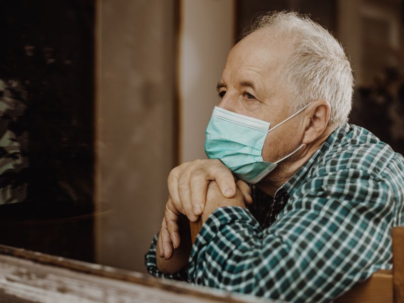 older man with mask quarantined